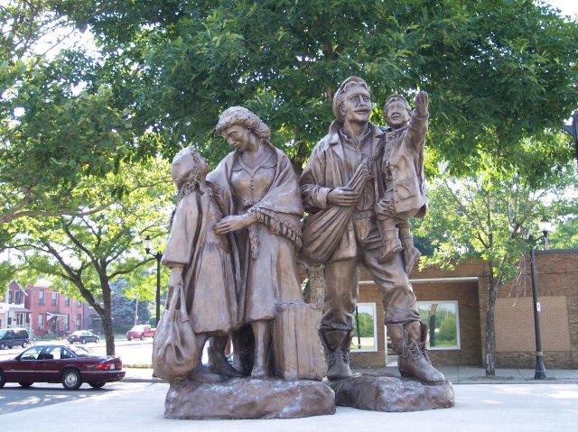 a statue dedicated to immigrants, photo by Joseph Raymond, in Hamilton Ontario, Canada, host site ChristianMuse.com